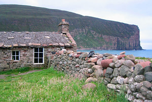 Stone cottage on beach at Hoy